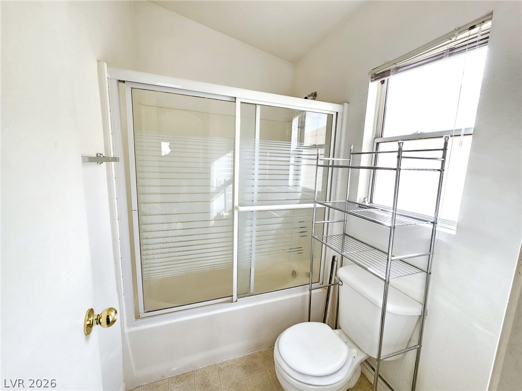 1663 Lefty Garcia Way Henderson, NV 89002 - Photo 2 of 31 Minimalist bathroom features a shower-over-tub combination and ample natural illumination.