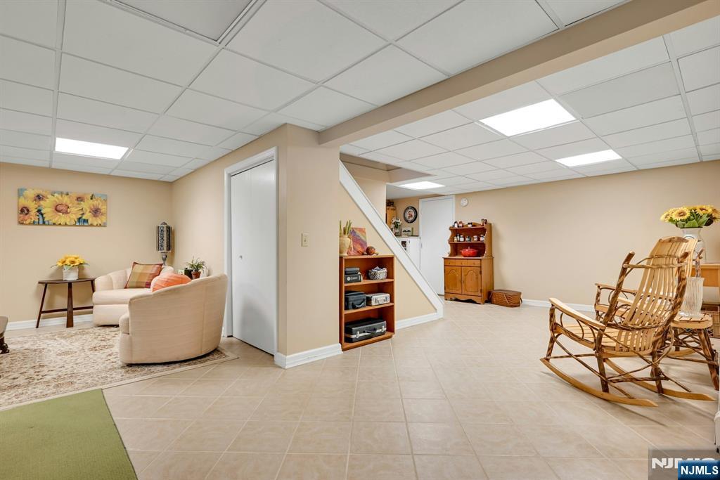 285 Chestnut Ridge Road Woodcliff Lake, NJ 07677 - Photo 45 of 46 a living room with furniture and a wooden floor