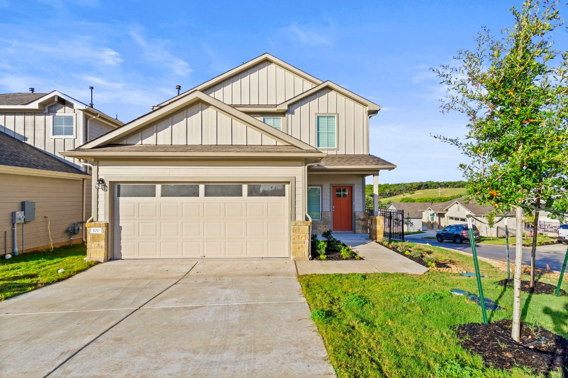 a front view of a house with a yard and porch