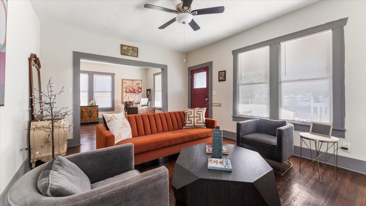 a living room with furniture and a large window