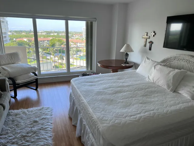 a bedroom with furniture and a window