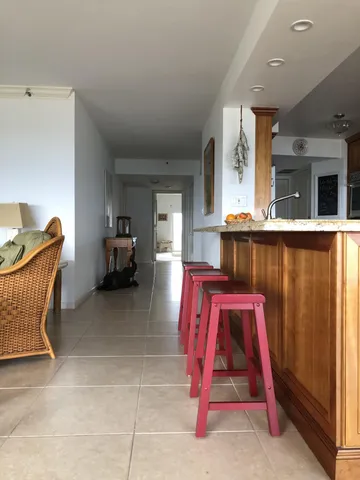 a spacious bedroom with a bed and a large window