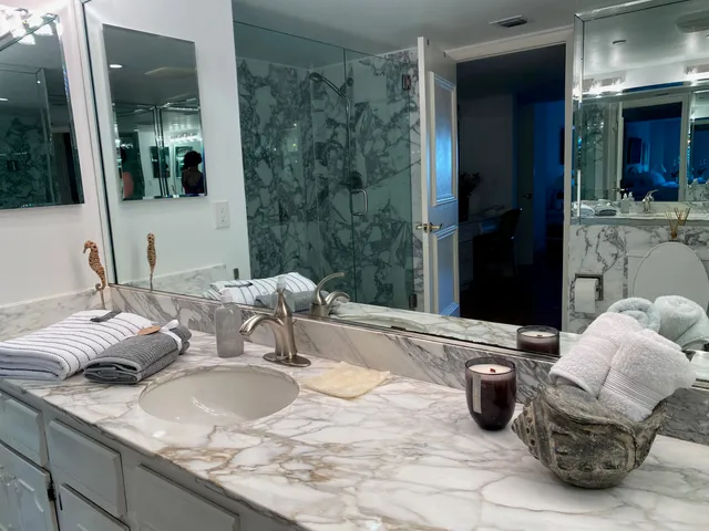 a dining room with furniture and potted plants
