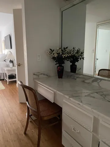a dining room with a wooden table and chairs