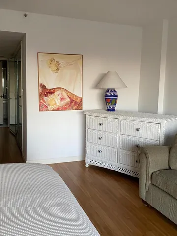 a front view of a bedroom with furniture and window