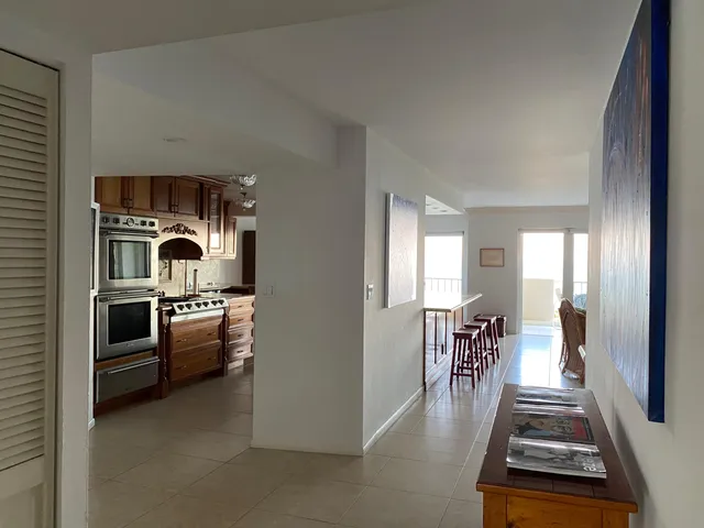 a bedroom with a bed and glass window