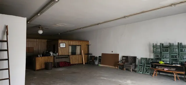 a view of a workspace with furniture