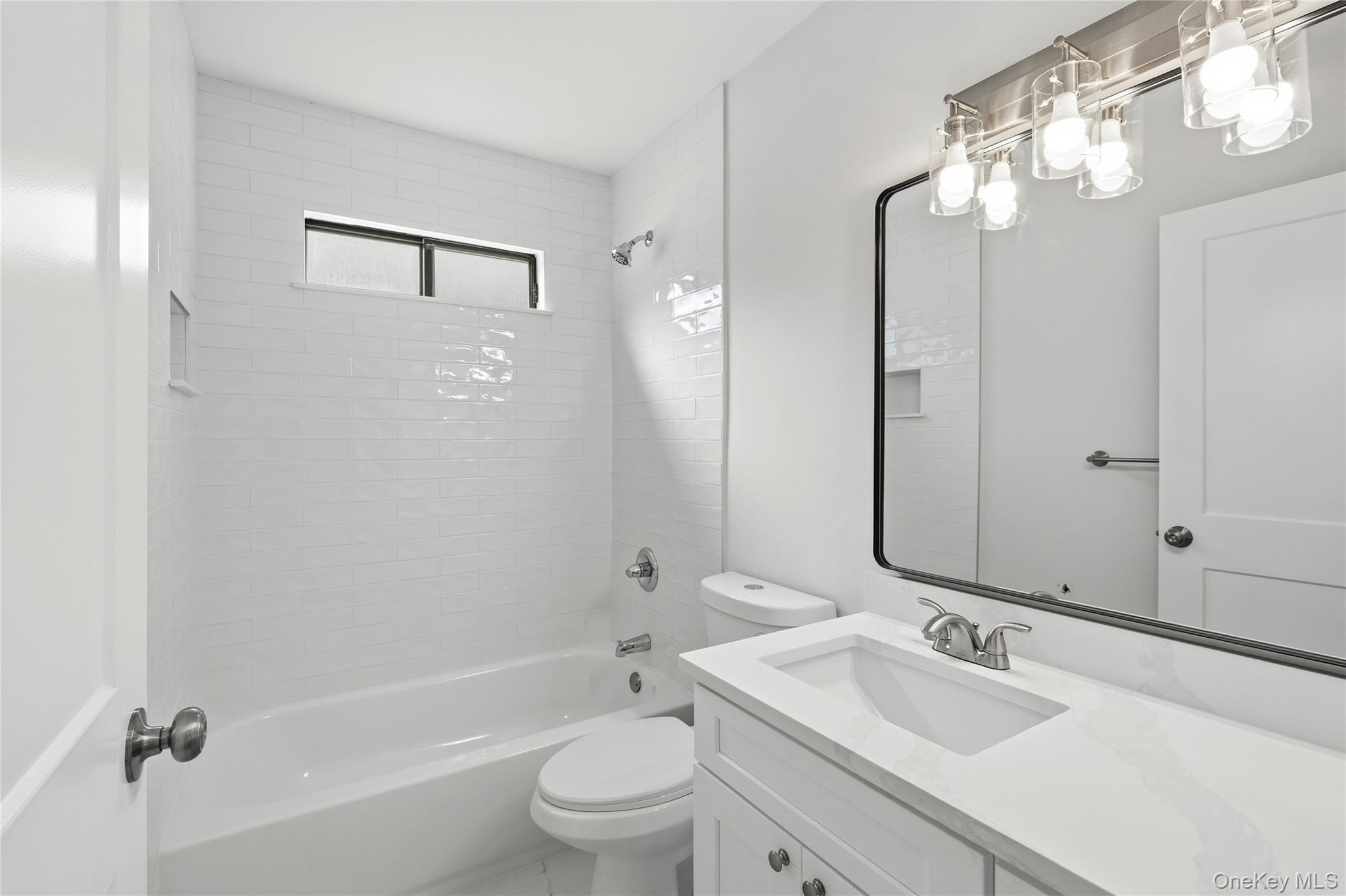 145 Edinburgh Drive Ridge, NY 11961 - Photo 13 of 13 a bathroom with a sink a toilet and shower
