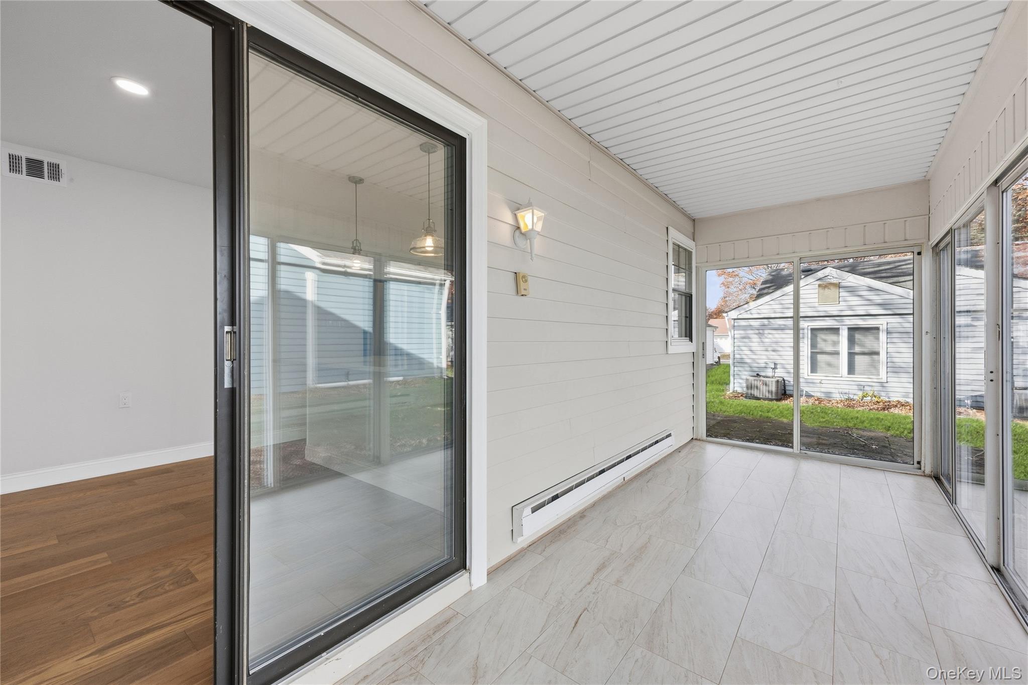 145 Edinburgh Drive Ridge, NY 11961 - Photo 9 of 13 a view of empty room with wooden floor and fan