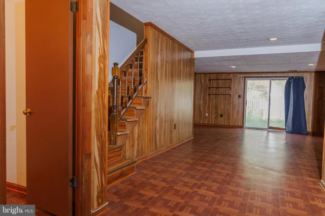 a view of an entryway with wooden floor