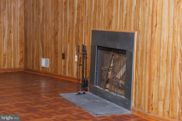 a view of front door with wooden floor
