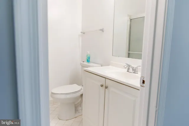 a bathroom with a sink toilet and vanity