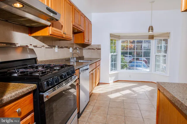 a kitchen with a stove and a sink