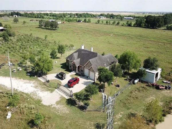 a view of a lake with a table and chairs