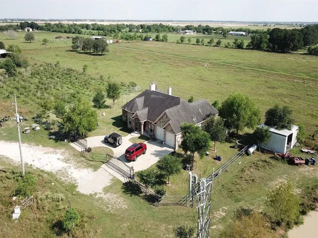 a view of a lake with a table and chairs