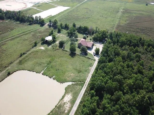a view of a forest with a houses