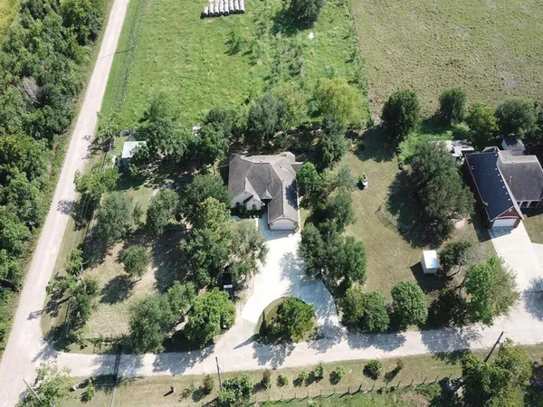 an aerial view of residential house with outdoor space