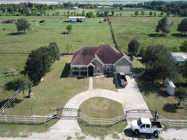 an aerial view of a house with outdoor space