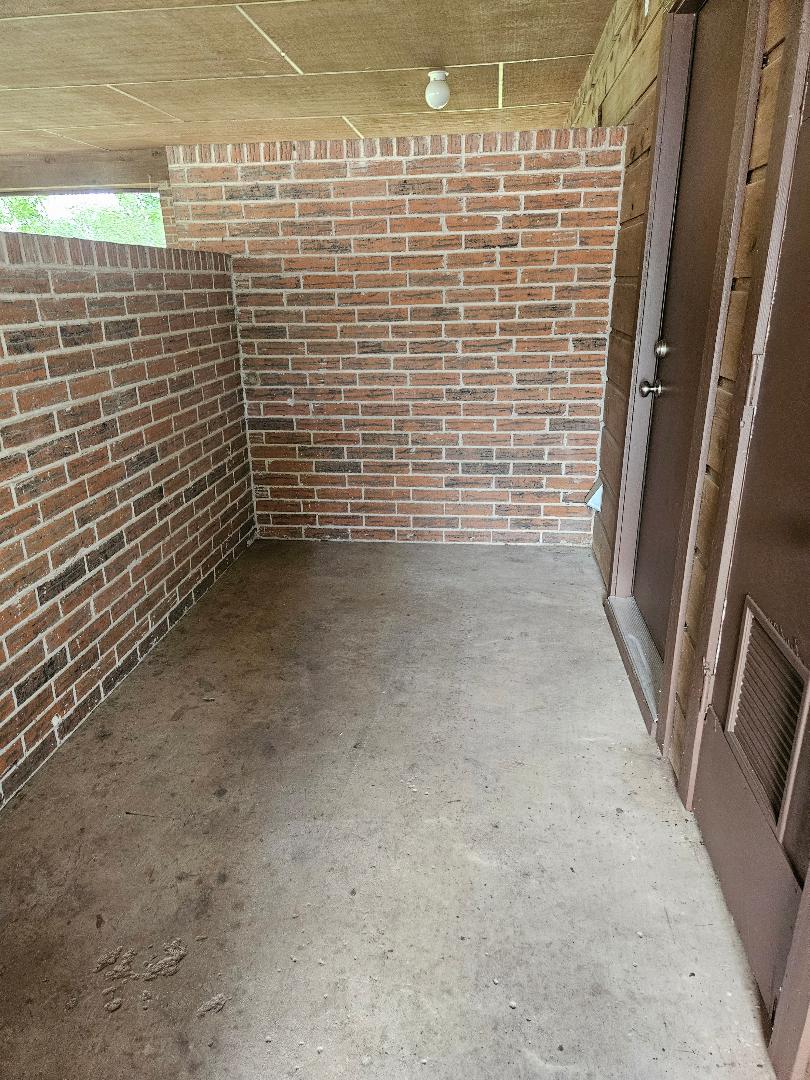 16 North Ave A, Unit B Elgin, TX 78621 - Photo 17 of 17 Storage area off the utility room for trash cans, etc