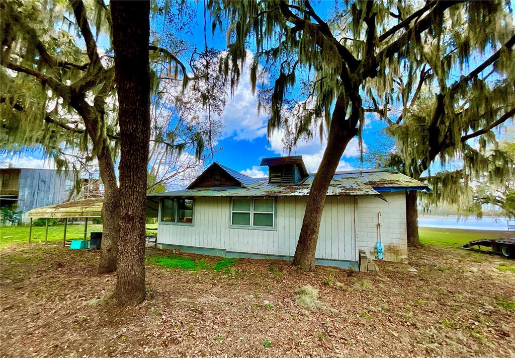 106 Sunny Side Beach Road Hawthorne, FL 32640 - Photo 1 of 54 a house with trees in front of it