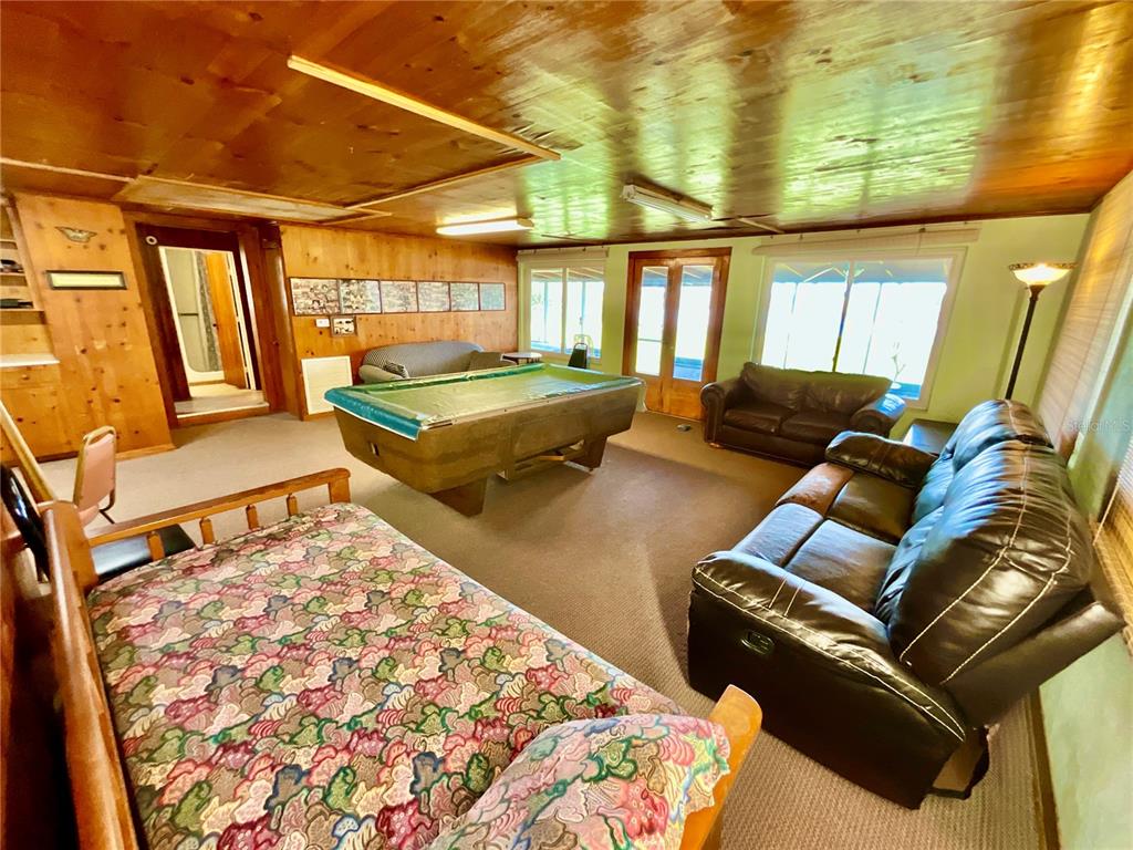 106 Sunny Side Beach Road Hawthorne, FL 32640 - Photo 11 of 54 a living room with a couch and wooden floor