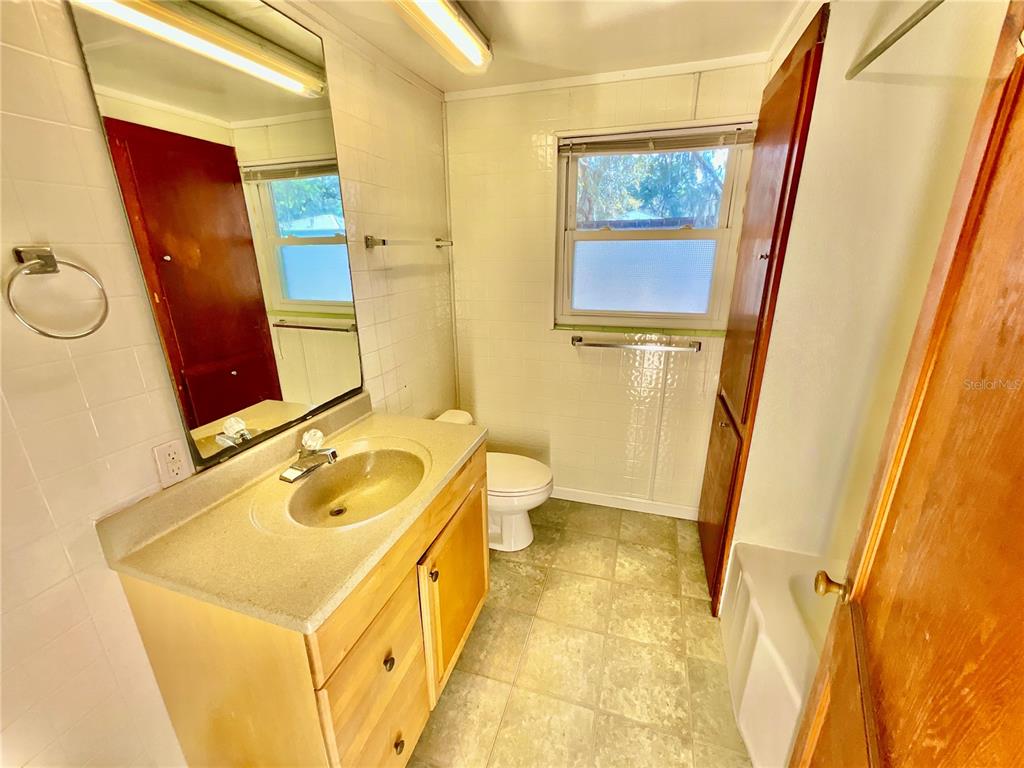 106 Sunny Side Beach Road Hawthorne, FL 32640 - Photo 25 of 54 a bathroom with a sink and a mirror