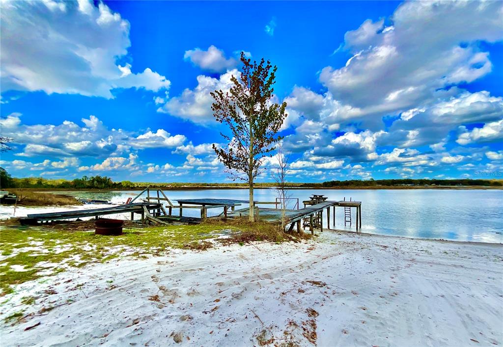 106 Sunny Side Beach Road Hawthorne, FL 32640 - Photo 27 of 54 a view of a lake with a nearby beach