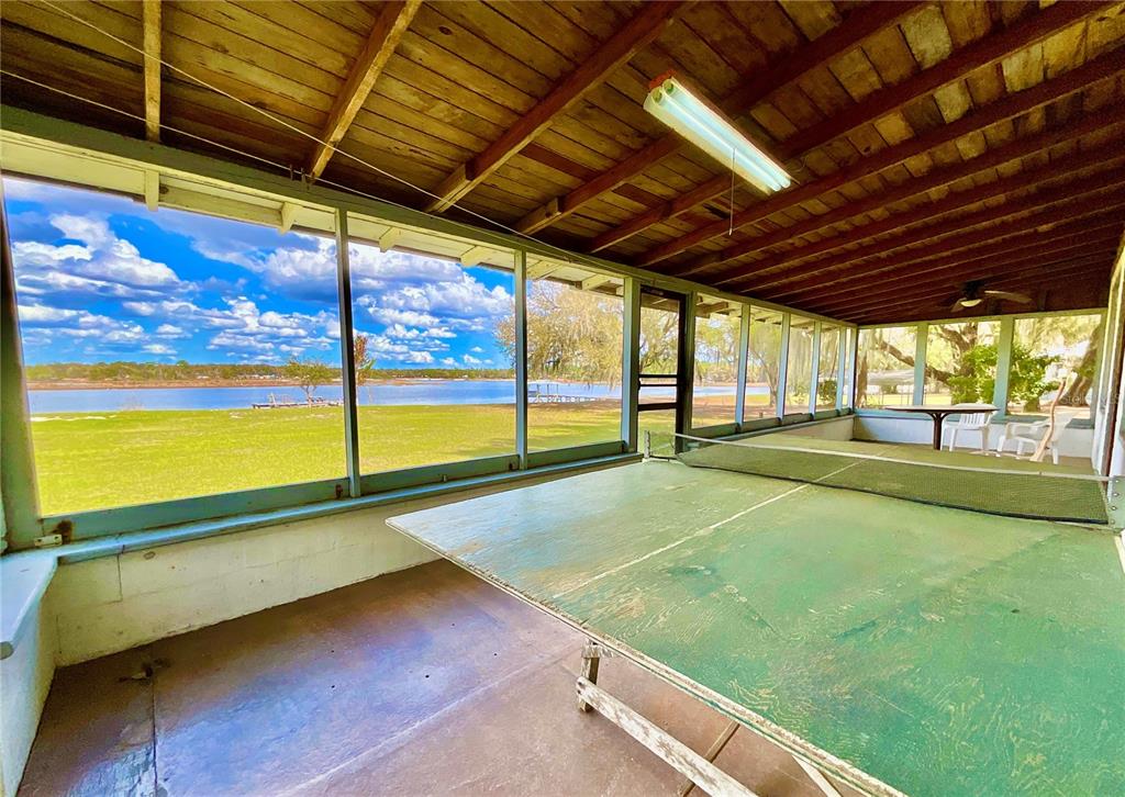 106 Sunny Side Beach Road Hawthorne, FL 32640 - Photo 36 of 54 a view of an empty room with a floor to ceiling window with an outdoor space