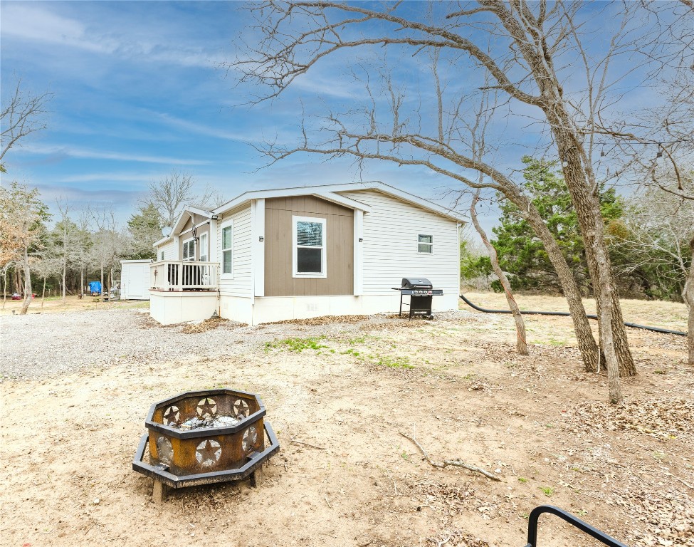 400 St Johns Road Dale, TX 78616 - Photo 13 of 17 View of home's exterior featuring a fire pit