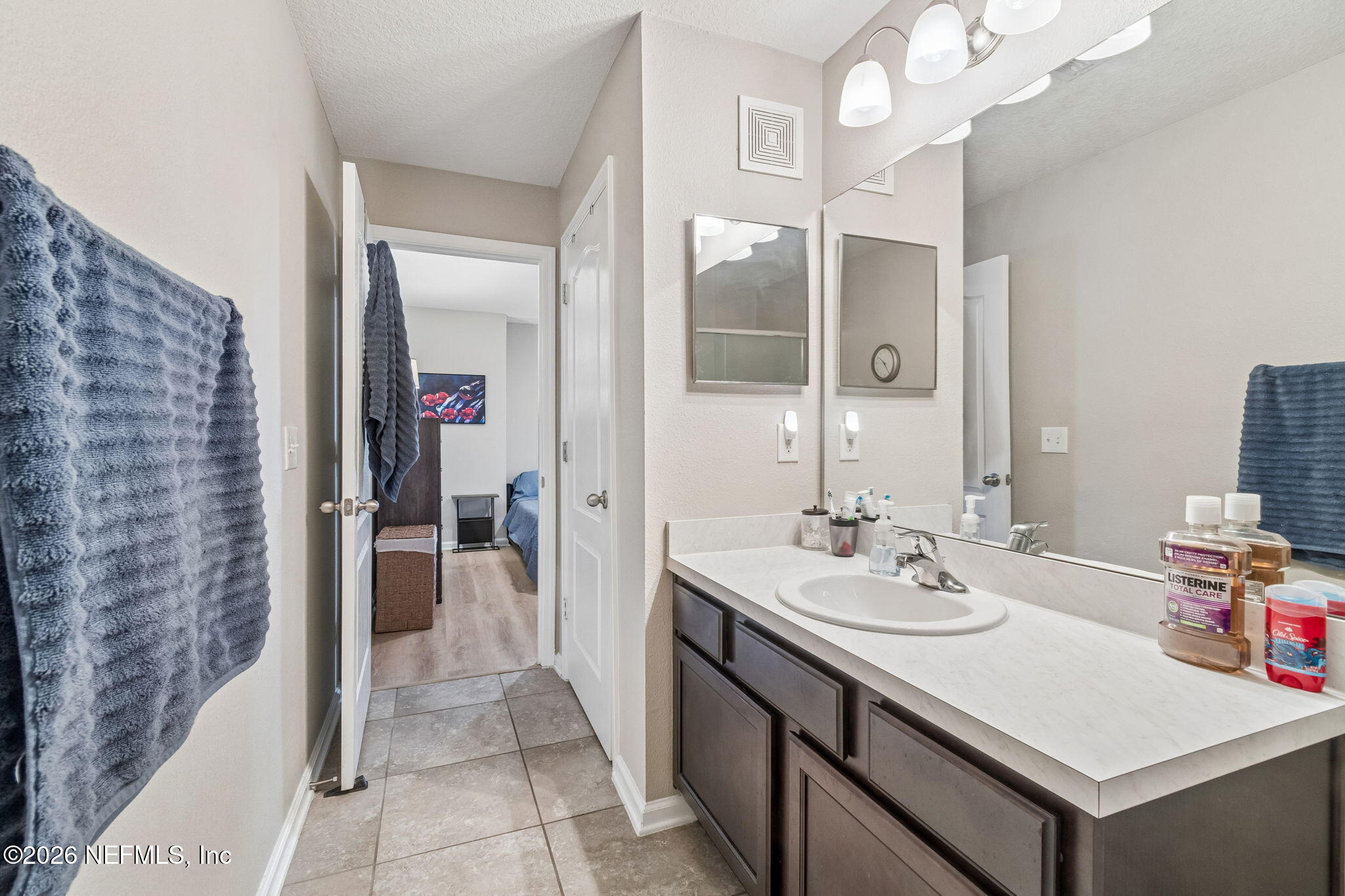 2113 Golden Lake Loop St. Augustine, FL 32084 - Photo 38 of 50 a bathroom with a sink vanity and a mirror