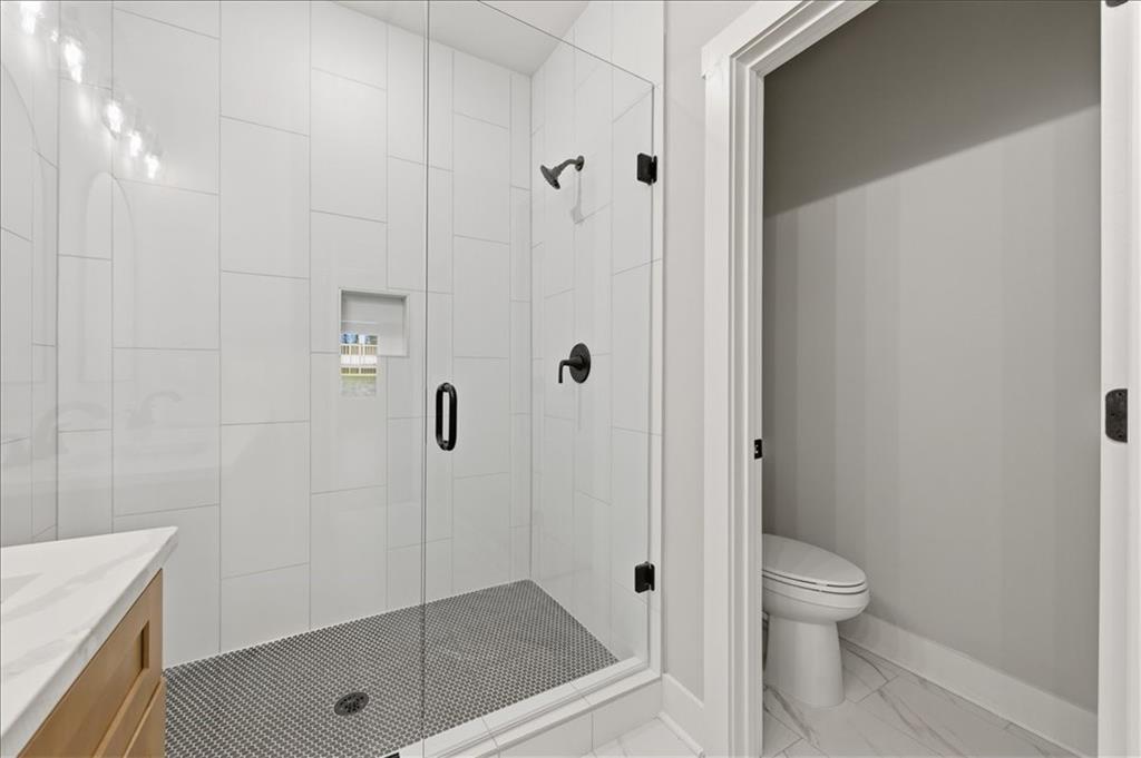 141 Old Alabama Road Southeast Emerson, GA 30137 - Photo 13 of 47 a bathroom with a shower a toilet and sink