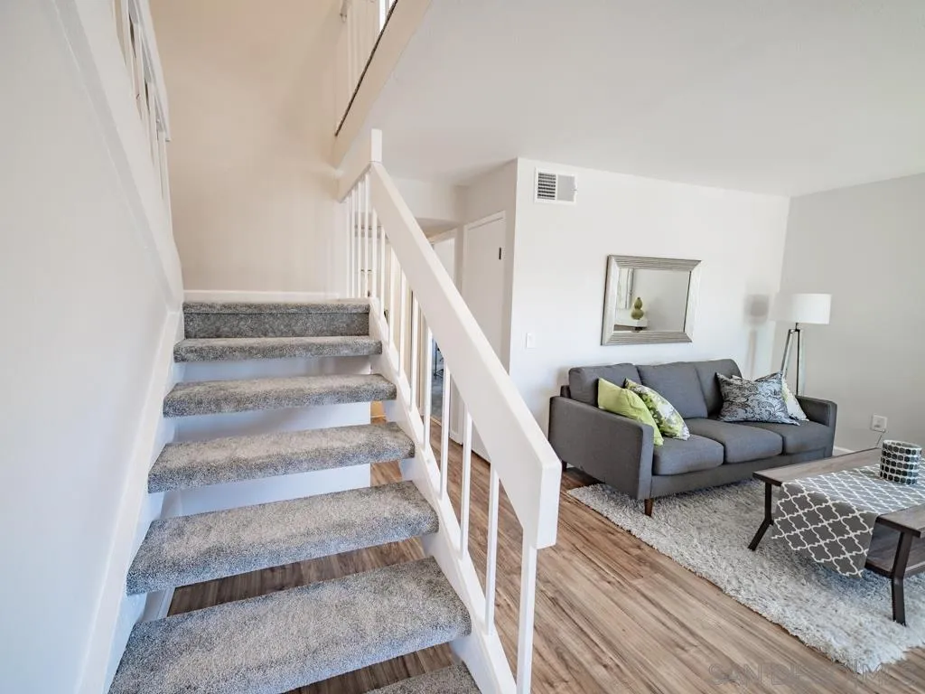 10911 Eddington Road Santee, CA 92071 - Photo 11 of 25 a living room with furniture and a stair