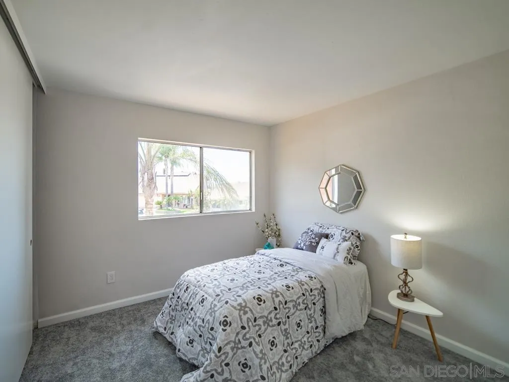 10911 Eddington Road Santee, CA 92071 - Photo 14 of 25 a bedroom with a bed and window