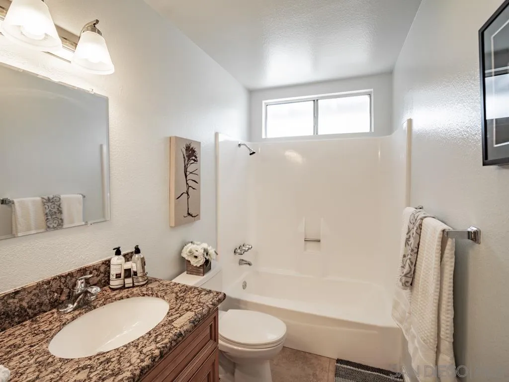 10911 Eddington Road Santee, CA 92071 - Photo 15 of 25 a bathroom with a sink toilet tub and shower