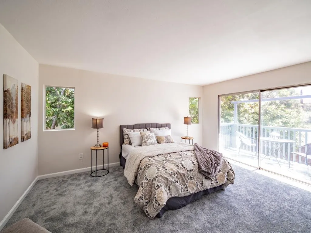 10911 Eddington Road Santee, CA 92071 - Photo 16 of 25 a bedroom with a bed and a large window
