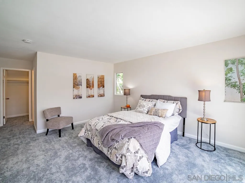 10911 Eddington Road Santee, CA 92071 - Photo 17 of 25 a bedroom with a bed and a chair