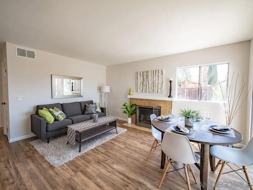 10911 Eddington Road Santee, CA 92071 - Photo 7 of 25 a living room with furniture a fireplace and a table