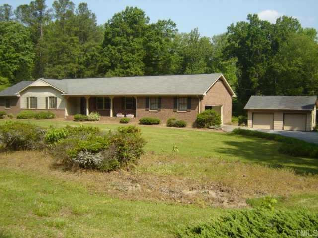 148 Stagecrest Drive Raleigh, NC 27603 - Photo 2 of 12 Nice curb appeal. Attached and detached garages. Wide parking pad. Plenty of room to park cars, trailer and boat. Exterior Front