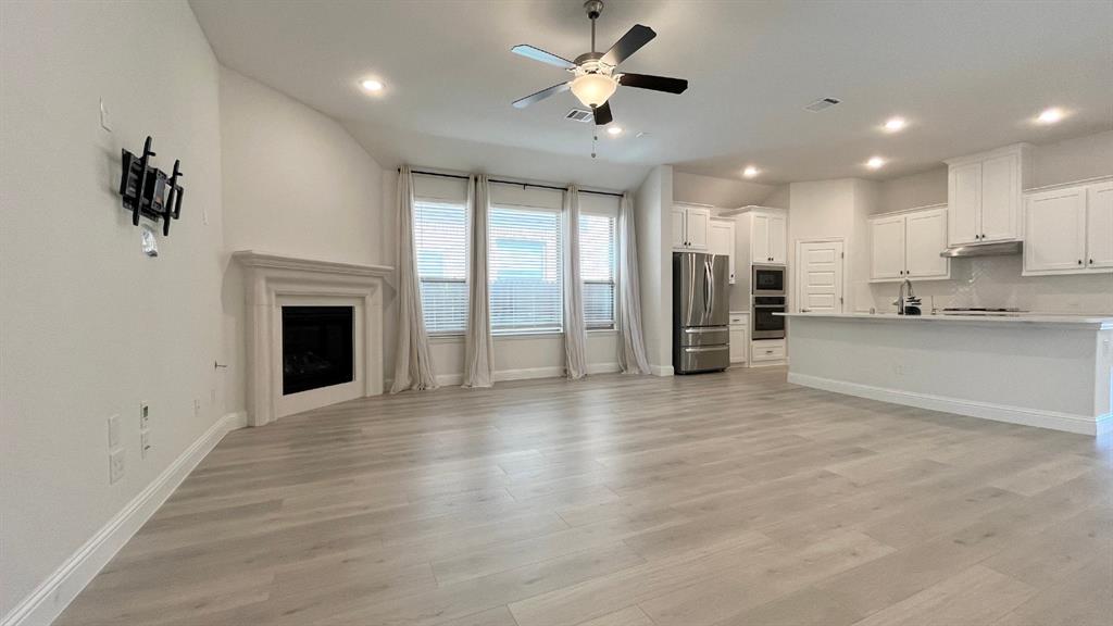 5304 Babcock Road McKinney, TX 75071 - Photo 8 of 27 a view of an empty room and a kitchen