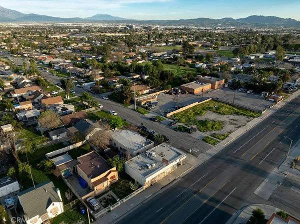 an aerial view of residential houses with city view