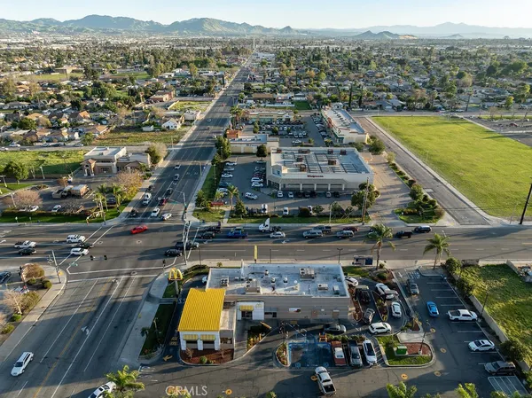 an aerial view of residential houses with city view