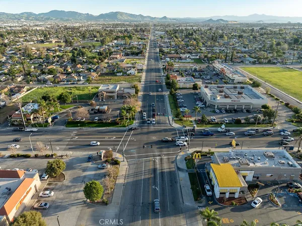 an aerial view of residential houses with city view