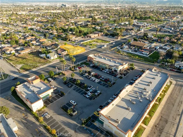 an aerial view of residential houses with city view