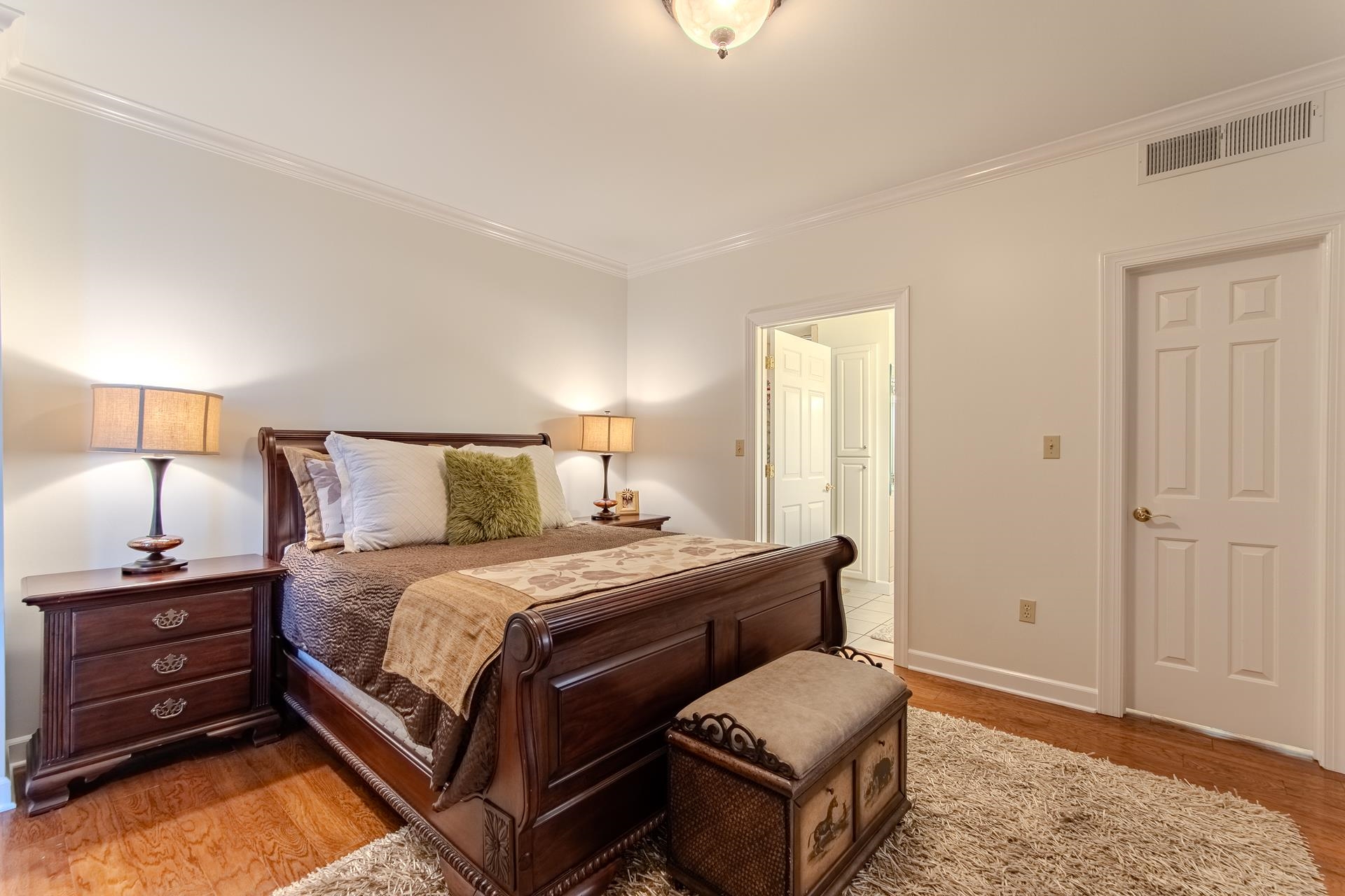 323 Cr 380 Road, Unit P604 Iuka, MS 38852 - Photo 16 of 38 a bedroom with a bed and a lamp