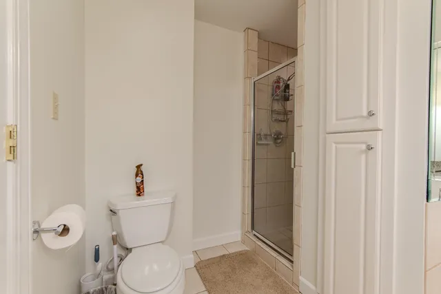 a bathroom with a toilet and shower