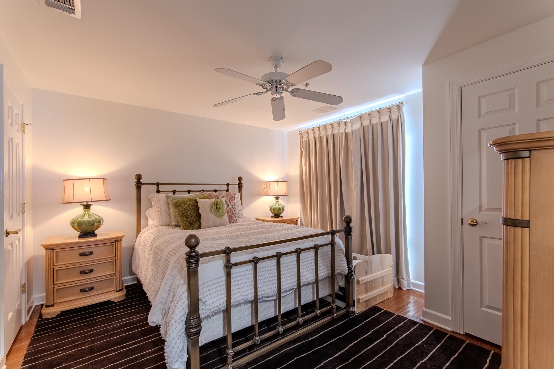 323 Cr 380 Road, Unit P604 Iuka, MS 38852 - Photo 19 of 38 a bedroom with a bed and a chandelier