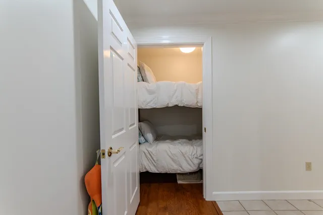 a room that has a bed and a chair in it