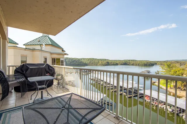 a view of a balcony with chair and wooden floor