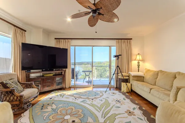 a bedroom with furniture and a flat screen tv