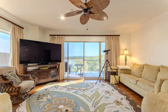 a bedroom with furniture and a flat screen tv